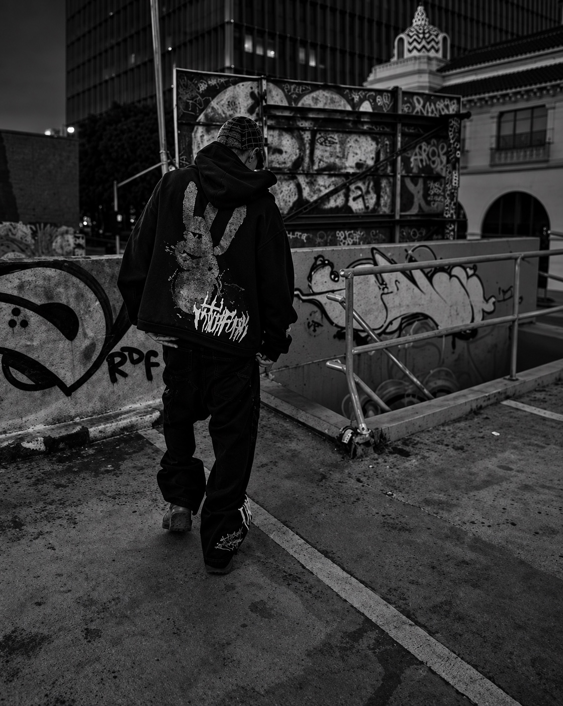 PITCH4CK streetwear campaign near graffiti